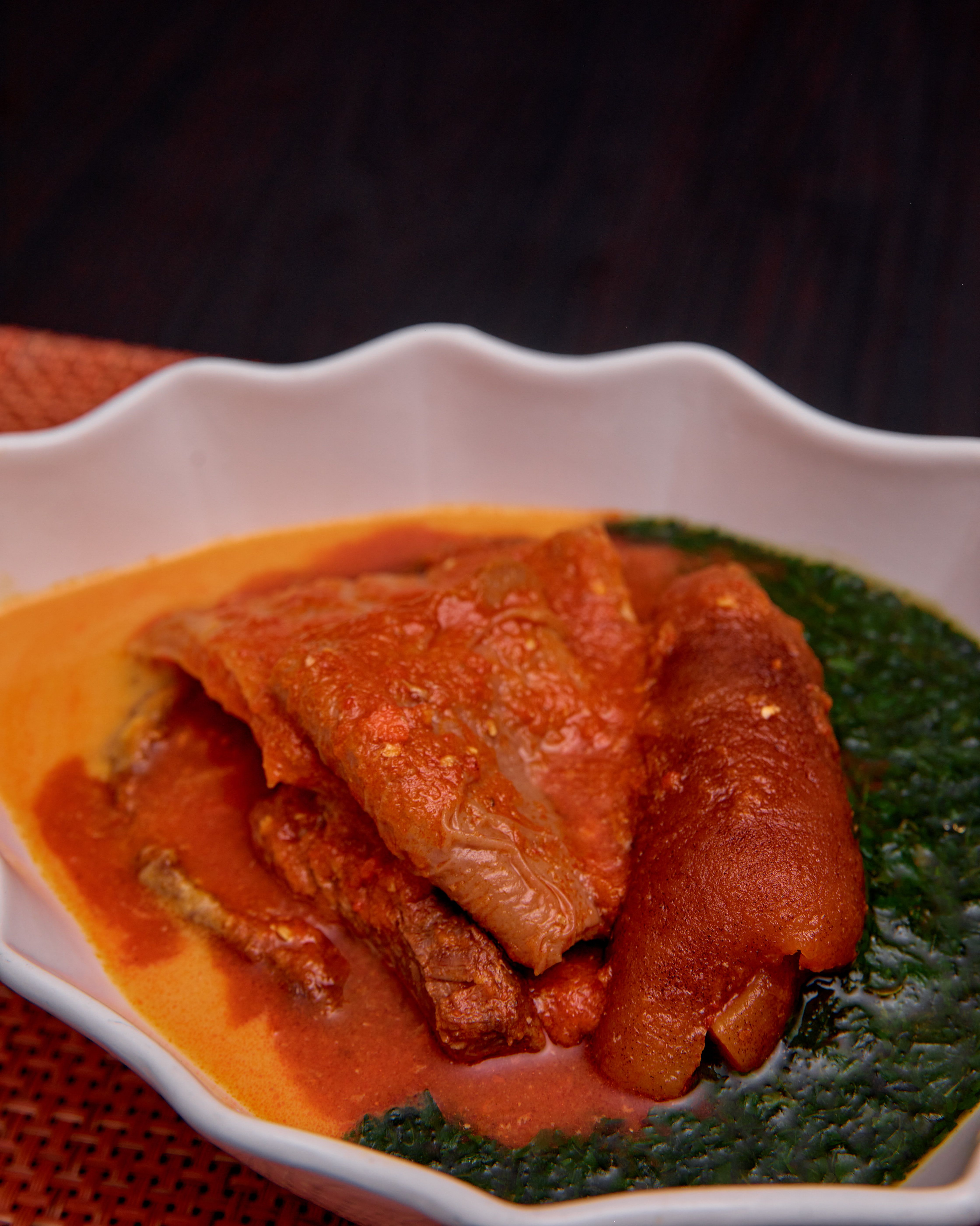 A deep green, leaf-dense Nigerian vegetable soup similar to edikang ikong, showing the vegetable-heavy style typical of Calabar cooking